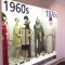photograph of mannequins in display case wearing 1960s dresses