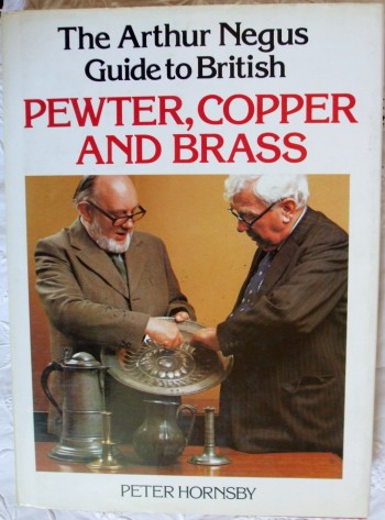 Book cover showing two men examining object